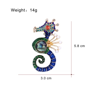 Colorful seahorse brooch with blue green crystals, abalone shell and pearls on gold base