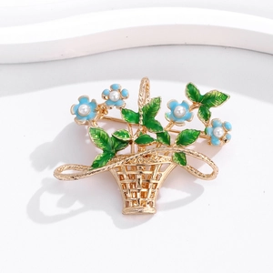 Detailed macro of golden flower basket brooch with blue enamel petals and pearls
