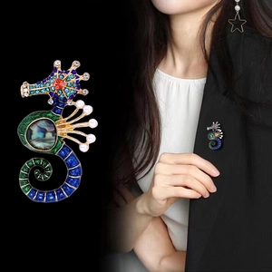 Golden seahorse brooch with colorful crystals, pearls and abalone shell inlay