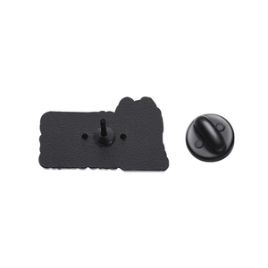 Detail view of black enamel alpaca brooch back with rubber pin clutch and non-slip texture
