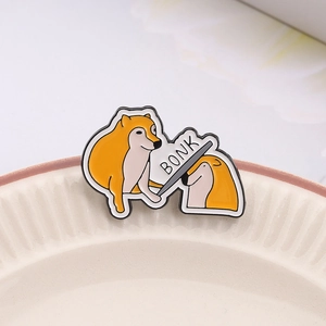 Funny Bonk Doge Meme enamel pin featuring two Shiba Inu dogs made of high-quality metal