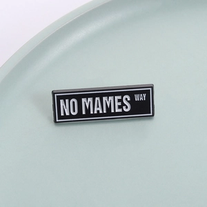 Minimalist black and white rectangle enamel pin with NO MAMES WAY text in zinc alloy