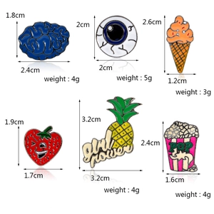 Spille creative in smalto con disegni di cervello, occhio, frutta e popcorn con misure
