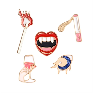Pop art enamel pins set with wine glass, lips, and eye shapes in gold-plated finish