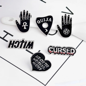 Gothic mystic enamel pins set featuring black Ouija board heart and witch palm designs