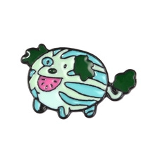 Close-up of watermelon dog enamel brooch with green stripes and cute leaf detail