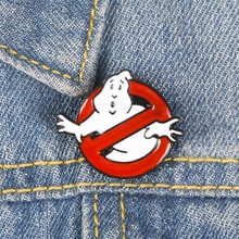 Detailed view of a classic Ghostbusters logo enamel pin pinned on a blue denim jacket collar