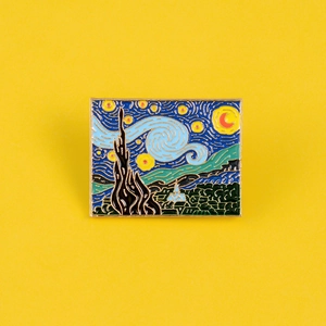 Artistic Van Gogh Starry Night enamel pin with vibrant blue and yellow colors on yellow background