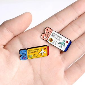 Cute enamel boarding pass pins with 'Adventure Awaits' text for travel themed backpacks