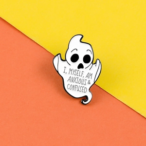 Close-up of ghost enamel pin with I myself am anxious and confused text detail