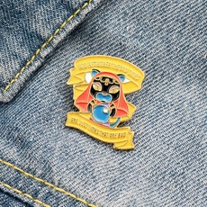 Detailed enamel pin of Katrina the fortune teller cat on a blue denim background