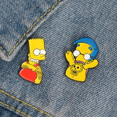 Cartoon enamel pins of animated characters on denim fabric showing trendy style