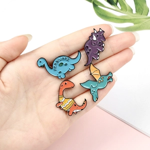 Set of four cute cartoon dinosaur enamel pins featuring colorful herbivore designs