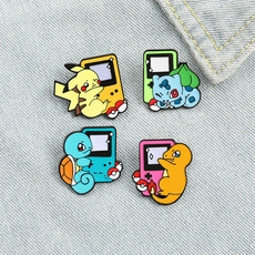 Detailed set of four colorful enamel Pokémon pins featuring retro Game Boy console designs
