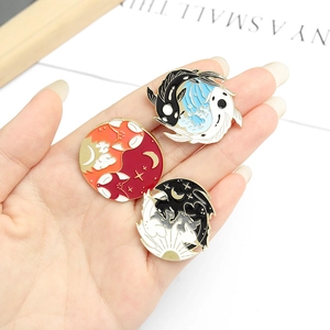 Three enamel pins set featuring yin yang koi, fox, and mystical beast in gold trim
