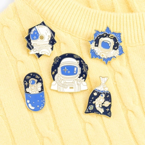 Five-piece set of astronaut enamel pins with dark blue star and space motifs for clothing