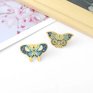 Vintage butterfly enamel brooch set with celestial sun moon patterns and gold plating