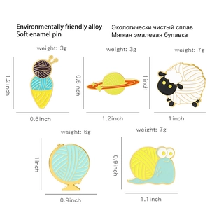 Creative enamel animal and globe brooches set featuring sheep and snail designs