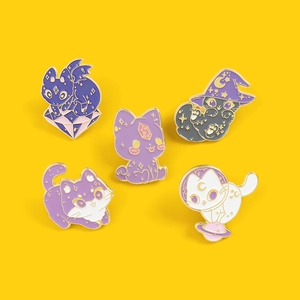 Set of five creative wizard cat enamel pins with mystical cosmic designs on yellow background