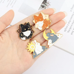 Cute cartoon animal enamel pins featuring fox and rabbit designs with sun and moon motifs