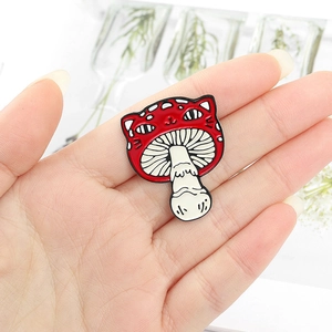 Creative enamel pin featuring a red cat-headed mushroom shape made of alloy