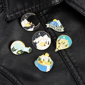 Set of 6 outdoor camping enamel pins featuring moon mountain and explore motifs on leather