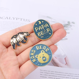 Three-piece forest bear enamel pin set with Mama Bear and Papa Bear designs