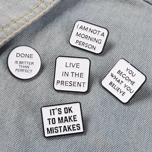 5pcs motivational white enamel pin set with black letter quotes on denim fabric