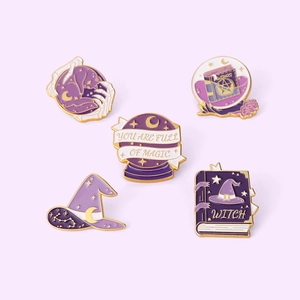 Set of 5 purple and gold magic themed enamel pins featuring wizard hat and magic books