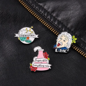 Scientific enamel pins set with Einstein and chemistry flasks on black leather jacket