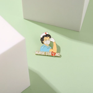 Detail of Nurse Strong enamel pin with heart stethoscope design on a minimal background