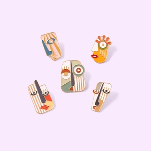 Set of five colorful Picasso-style abstract face enamel pins in zinc alloy finish