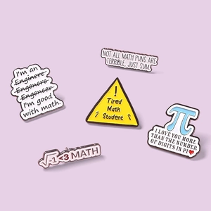 Detail of five creative mathematical Pi symbol enamel pins on a purple background