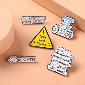Detailed view of math enamel pin set with pi and engineering humor on a warm background