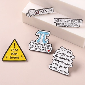 Detailed macro shot of creative mathematical Pi enamel pins on white geometric props