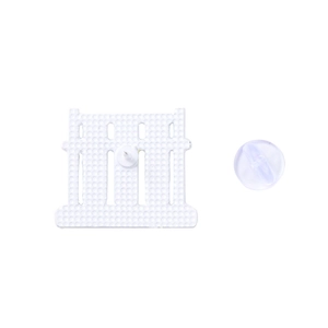 Reverse view of white enamel arch brooch showing textured metal back and silicone clasp
