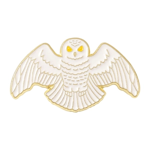 Exquisite flying white snowy owl enamel pin with gold detailing and yellow eyes