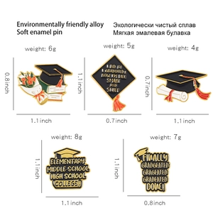 Detailed view of graduation enamel pins showing size and weight for various academic designs