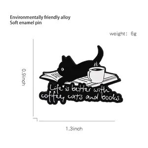 Cute black cat on open book enamel pin with coffee cup design and product dimensions