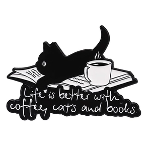 Detailed view of enamel pin with black cat on books and life is better with coffee quote