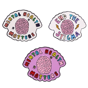 Pink brain enamel pins set featuring Mental Health Matters and End the Stigma slogans
