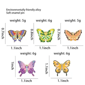 Guide des tailles de broches papillon colorées en émail avec dimensions et poids précis