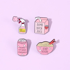 Close-up of four pink enamel pins featuring creative soda and noodle designs