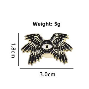 Dark gothic eagle eye enamel pin with wings, black and gold alloy brooch 3.0cm