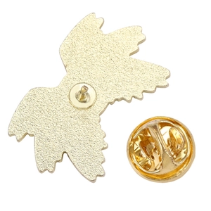Back view of golden eagle eye alloy brooch featuring butterfly clasp and textured finish