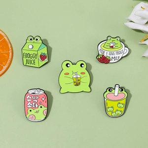 Set of five cartoon frog enamel pins featuring cute milk carton and juice box designs