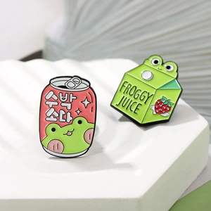Cute cartoon frog enamel pins featuring a red soda can and green juice box milk carton