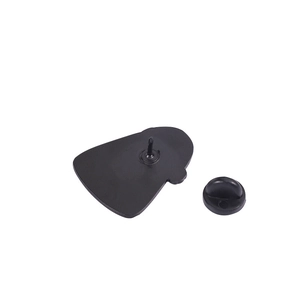 Detail view of the black metal badge backing and rubber pin clutch fastener