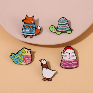 Set of five cartoon animal enamel brooches featuring foxes and geese in sweaters