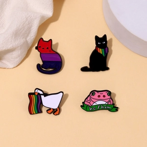 Set of 4 cute cartoon animal enamel pins including pride flags and inclusive pronouns